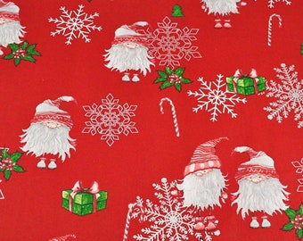 May include: Red fabric with a repeating pattern of white snowflakes, green holly sprigs, candy canes, and gnomes wearing red hats and white beards. The gnomes are holding presents.
