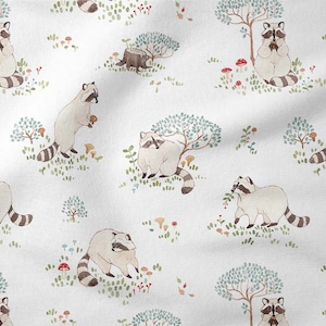 May include: A white fabric with a repeating pattern of raccoons, trees, mushrooms, and berries. The raccoons are depicted in a watercolor style and are holding various items, such as berries and mushrooms. The trees are green and blue, and the mushrooms are red and brown.