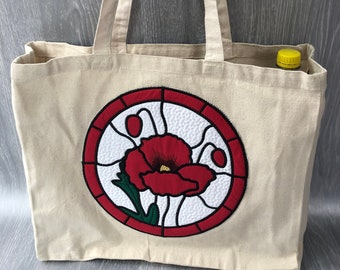 Heavy canvas tote bag with poppy design. Reusable and eco friendly.