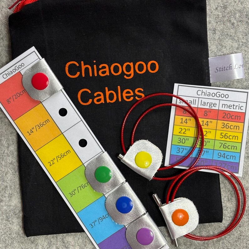 May include: A set of colorful ChiaoGoo knitting cables in various sizes, ranging from 8 inches to 37 inches. The cables are red and come with silver-colored ends. A chart shows the corresponding measurements in inches and centimeters.