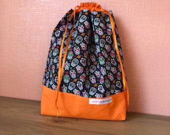 Halloween-sugar skull print project bag with ribbon closure. Orange contrast.