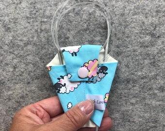 Sheep print needle keeper for circular knitting needles. Sheep print needle tamer.