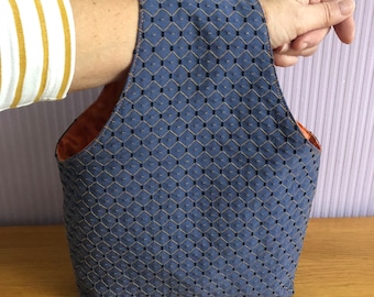 Over arm project bag for knitting or crochet.