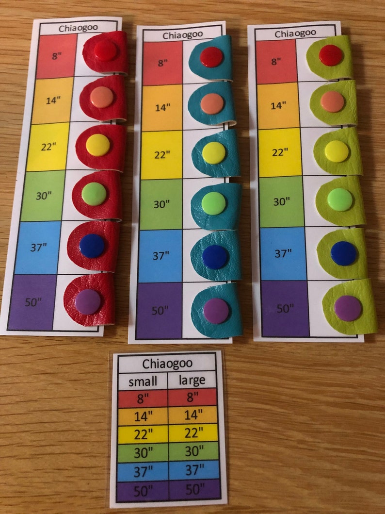 May include: Three sets of colorful circular labels with different sizes marked in inches, 8", 14", 22", 30", 37", and 50".  A separate chart shows the sizes "small" and "large" with the same sizes listed.