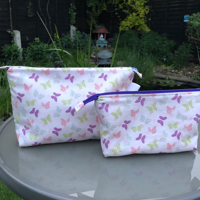 Zipped, padded butterfly print bags, cosmetics bag, toiletries b Zipped, padded butterfly print bags, cosmetics bag, toiletries b