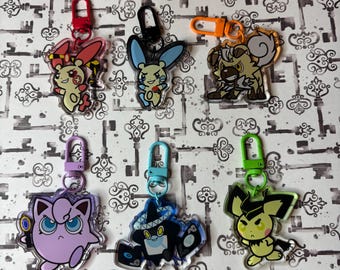 Llavero acrílico TWSTxPKMN: Diseño degradado de doble cara