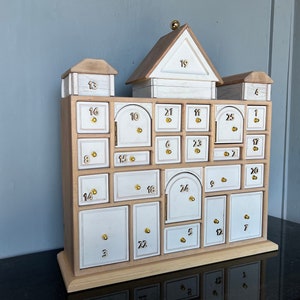 Heirloom Advent Calendar Apothecary cabinet solid wood and brass. Inquire about rush fabrication.