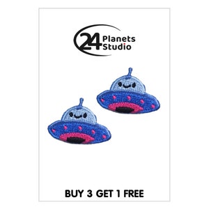 May include: Two blue and pink embroidered iron-on patches of cute cartoon UFOs with smiling faces.  The patches are for clothing, bags, or other fabric items.  BUY 3 GET 1 FREE.
