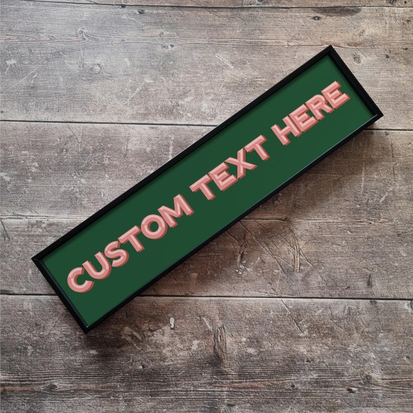 May include: A black framed sign with a green background and the text "CUSTOM TEXT HERE" in pink letters.