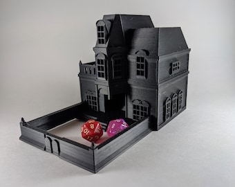 May include: A black 3D printed house shaped dice tower with a removable roof and a fence around the base. Two dice, one red and one purple, are inside the tower.