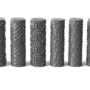 May include: A collection of ten gray, cylindrical objects with textured surfaces. Each cylinder features a unique pattern, including geometric shapes, crisscrossing lines, and organic, web-like designs. The objects are arranged in a row against a white background.