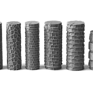 May include: A collection of ten gray miniature columns with varying textures. Designs include brick, stone, and geometric patterns. The columns are cylindrical and stand upright, suitable for model building or decorative purposes.