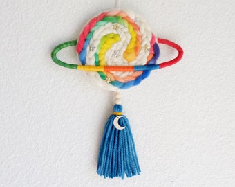 Planet Saturn woven wall charm. Ready to ship fiber art weaving wall hanging for nursery kids space celestial bedroom.