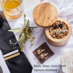 Groomsmen gift box comes with personalized tie clip and knot cufflinks. Black, Silver and Gold finish available for time to suit up groomsman gift box.