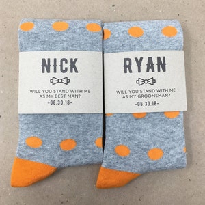 Orange polka dot socks with our custom best man and groomsman labels.