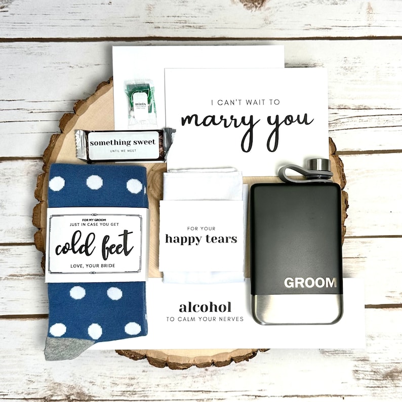 Items inside groom gift box: Socks with Just Incase of Cold Feet Label, Mini Tic Tac Mints with For a Fresh First Kiss Sticker, Mini Hersey's Bar with "Something Sweet" Sticker and more.