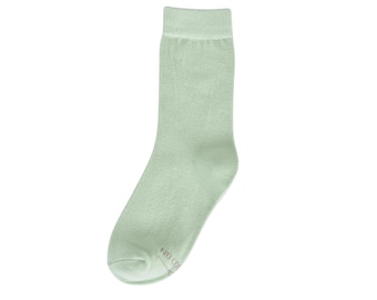 May include: A pair of light green socks.