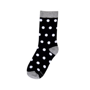 May include: Black and white polka dot socks with a gray cuff.