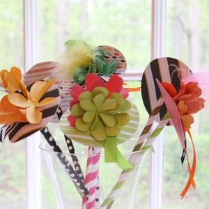 These super cute and unique Kentucky Derby Party hat drink stirrers are sure to cause a stir at your next party.  Perfect to display on the bar for your next equestrian themed event.  Everyone gets a Derby Hat to use in their drink