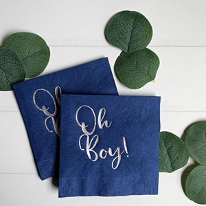 'Oh Boy' in ice blue foil on white paper napkins are the perfect touch for balancing all the tasty treats that will be served at the baby shower!
You can select your color choice from the drop down menu.  Everything from forest green and gold, to red on white, and ice blues and navys.  You can match your baby shower themes with ease with these napkins.