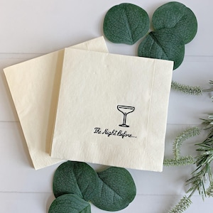 Add a touch of elegance to your rehearsal dinner with our "The Night Before" Elegant Cocktail Napkins in black matte foil. Each pack includes 16 ivory cocktail napkins, beautifully embellished with script that reads "the night before"
