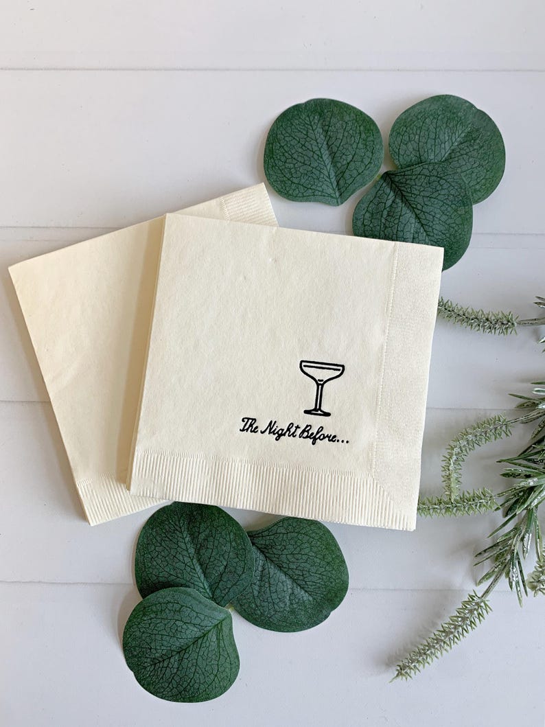 Add a touch of elegance to your rehearsal dinner with our "The Night Before" Elegant Cocktail Napkins in black matte foil. Each pack includes 16 ivory cocktail napkins, beautifully embellished with script that reads "the night before"