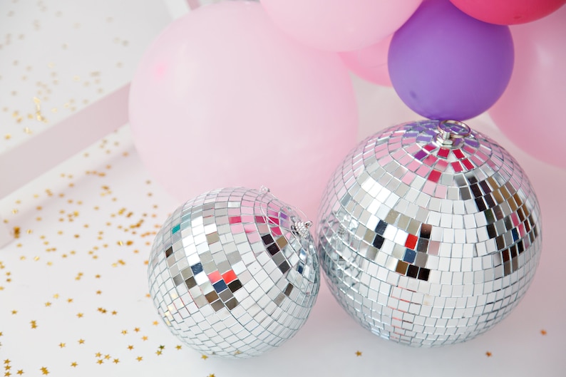 A gorgeous accent to your glamorous party - these mirrored foam core disco balls are lighter weight and perfect to hang for your disco party, bachelorette party, birthday or New Year's Eve bash!