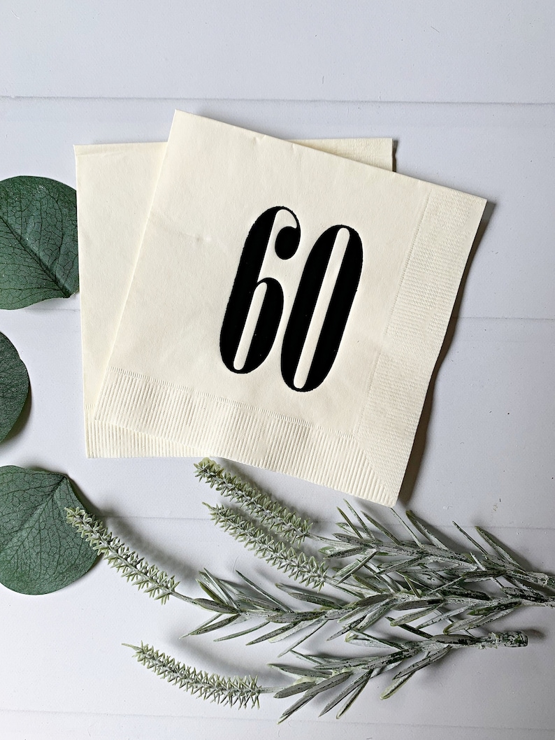 Sharp retro number 60 on an ivory napkin.  Both modern and nostalgic.  Perfect for a 60th birthday party for this special milestone.  Cocktail-sized napkins.