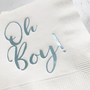 'Oh Boy' in ice blue foil on white paper napkins are the perfect touch for balancing all the tasty treats that will be served at the baby shower!
You can select your color choice from the drop down menu.  Everything from forest green and gold, to red on white, and ice blues and navys.  You can match your baby shower themes with ease with these napkins.