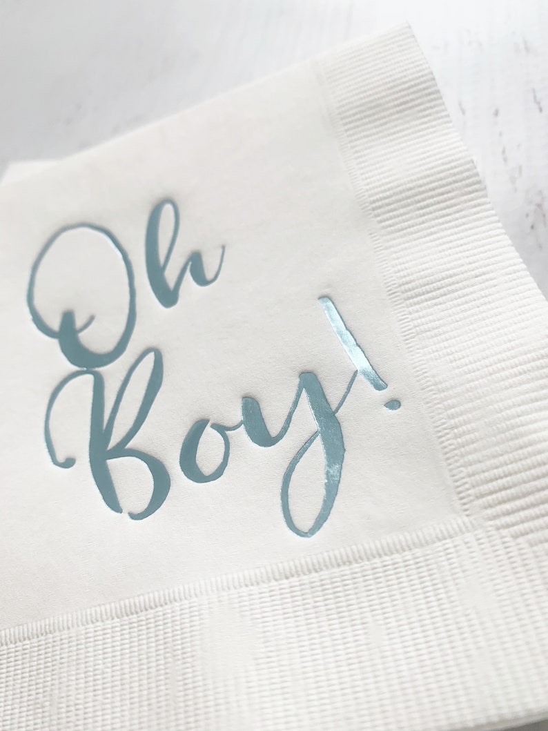 'Oh Boy' in ice blue foil on white paper napkins are the perfect touch for balancing all the tasty treats that will be served at the baby shower!
You can select your color choice from the drop down menu.  Everything from forest green and gold, to red on white, and ice blues and navys.  You can match your baby shower themes with ease with these napkins.