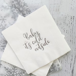 Baby it's cold outside luncheon napkins for a winter baby shower.  Silver foil words on a white paper napkin.  Set of 16 napkins.