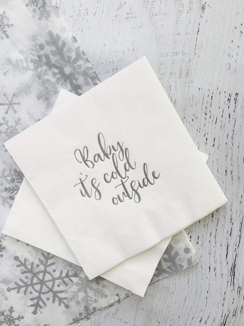 Baby it's cold outside luncheon napkins for a winter baby shower.  Silver foil words on a white paper napkin.  Set of 16 napkins.