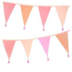 May include: A decorative bunting banner featuring two rows of triangular fabric flags in various shades of pink, peach, and coral. Each individual flag is finished with a small, matching pink tassel attached to the bottom point.