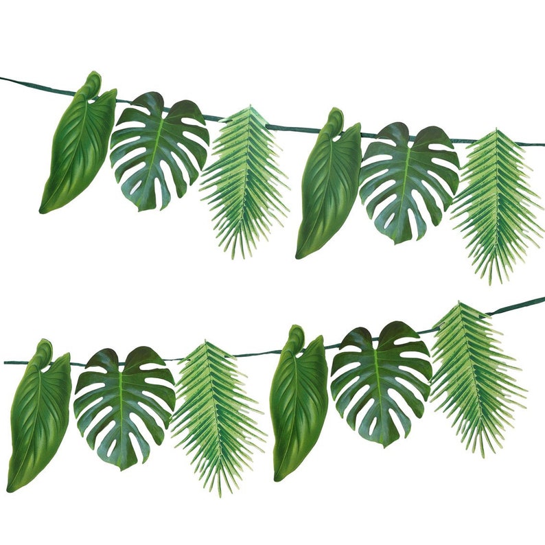 May include: A green tropical leaf garland with various leaf shapes, including palm leaves and monstera leaves. The garland is strung together with a thin string.