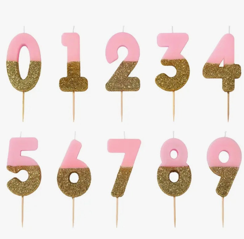 Make every milestone birthday special with EnFete's Pink and Gold Glitter Dipped Birthday Number Candles. Available in all numbers, from 1 to 100, add a touch of magic and sparkle to your celebration. Shop now!