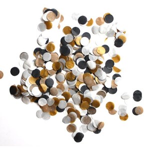 May include: A collection of small, circular paper confetti pieces scattered in a cluster. The confetti features a colour palette of matte black, metallic gold, silver, and translucent white circles, creating a varied and layered visual effect.