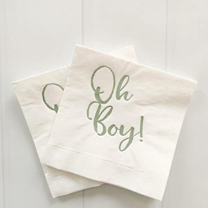 'Oh Boy' in ice blue foil on white paper napkins are the perfect touch for balancing all the tasty treats that will be served at the baby shower!
You can select your color choice from the drop down menu.  Everything from forest green and gold, to red on white, and ice blues and navys.  You can match your baby shower themes with ease with these napkins.