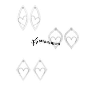 May include: A set of six silver earrings with a heart design. The earrings are in three different shapes: two are teardrop shaped, two are diamond shaped, and two are oval shaped.