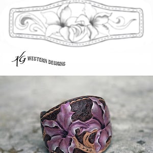 May include: A leather cuff bracelet with a carved design of two purple flowers. The bracelet is brown and has a textured surface.