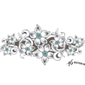 May include: A white floral design with turquoise accents. The design features stylized flowers with swirling vines. The design is set against a brown background.