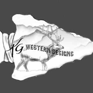 May include: Black and white illustration of an arrowhead shape with a mountain scene and a deer. The text "KG Western Designs" is displayed on the arrowhead.