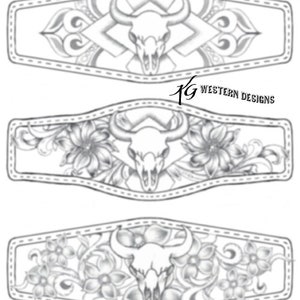 May include: Three black and white line drawings of a skull with horns, surrounded by floral designs. The designs are in a rectangular shape with a stitched border.