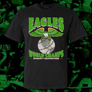 May include: Black t-shirt with a green eagle graphic and the text "Eagles World Champs LII Dynasty Destroyers LIX".