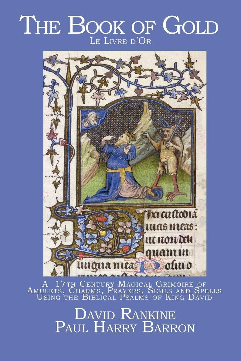 May include: A book cover with a blue background and gold lettering. The title is "The Book of Gold" with the subtitle "Le Livre D'Or". The cover features an illustration of a man kneeling in prayer with a devil behind him. The text "Axi cuſtodia mas meas: ut non delh quam im lingua mea olmo" is visible in the illustration.