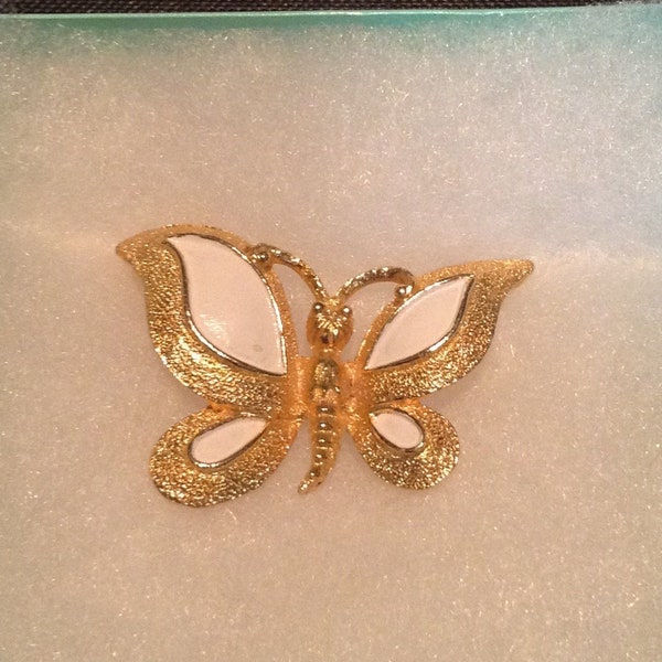 Signed Florenza butterfly brooch pin, gold tone, white enamel on wings.