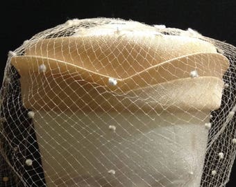 Union made very light orange/yellow open pillbox hat with flocked netting, 19 1/2 inches, made in USA.