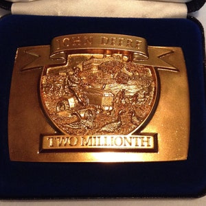 John Deere two millionth 1992 24K triple plated belt buckle, collectible, original case but no booklet, antiqued and highly polished.