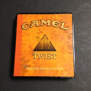 camel twist cigarettes Camel Twist Cigarette Metal Tin in Orange, Black, Yellow, and Gold Colors,  Inside is Silver Tone, 1960s