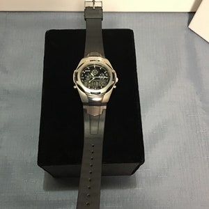 Vintage Sonic Chrono wristwatch, Japan Movement, analog, digital, new battery, heavy black plastic buckle wristband, water resistant.