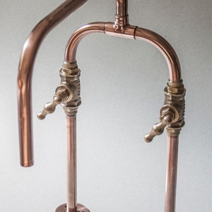 Biped is a deck mount industrial style handmade copper pipe tap made by Switchrange